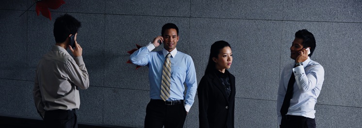 four people on phones